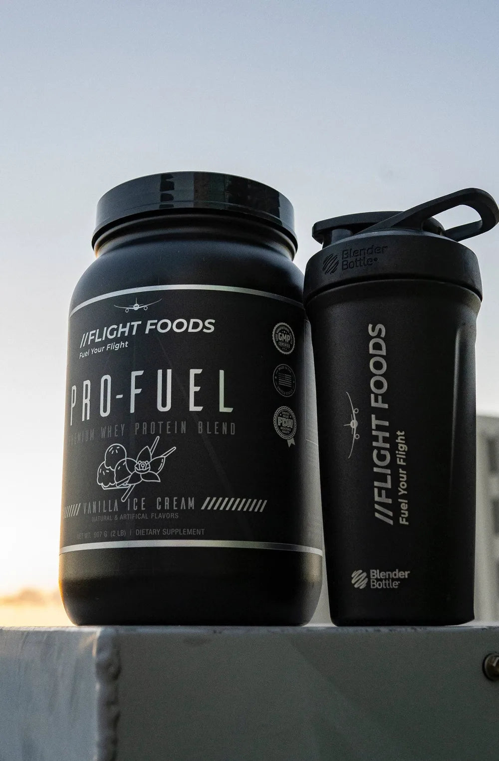 Pro-Fuel tub and Flight Foods shaker at sunset