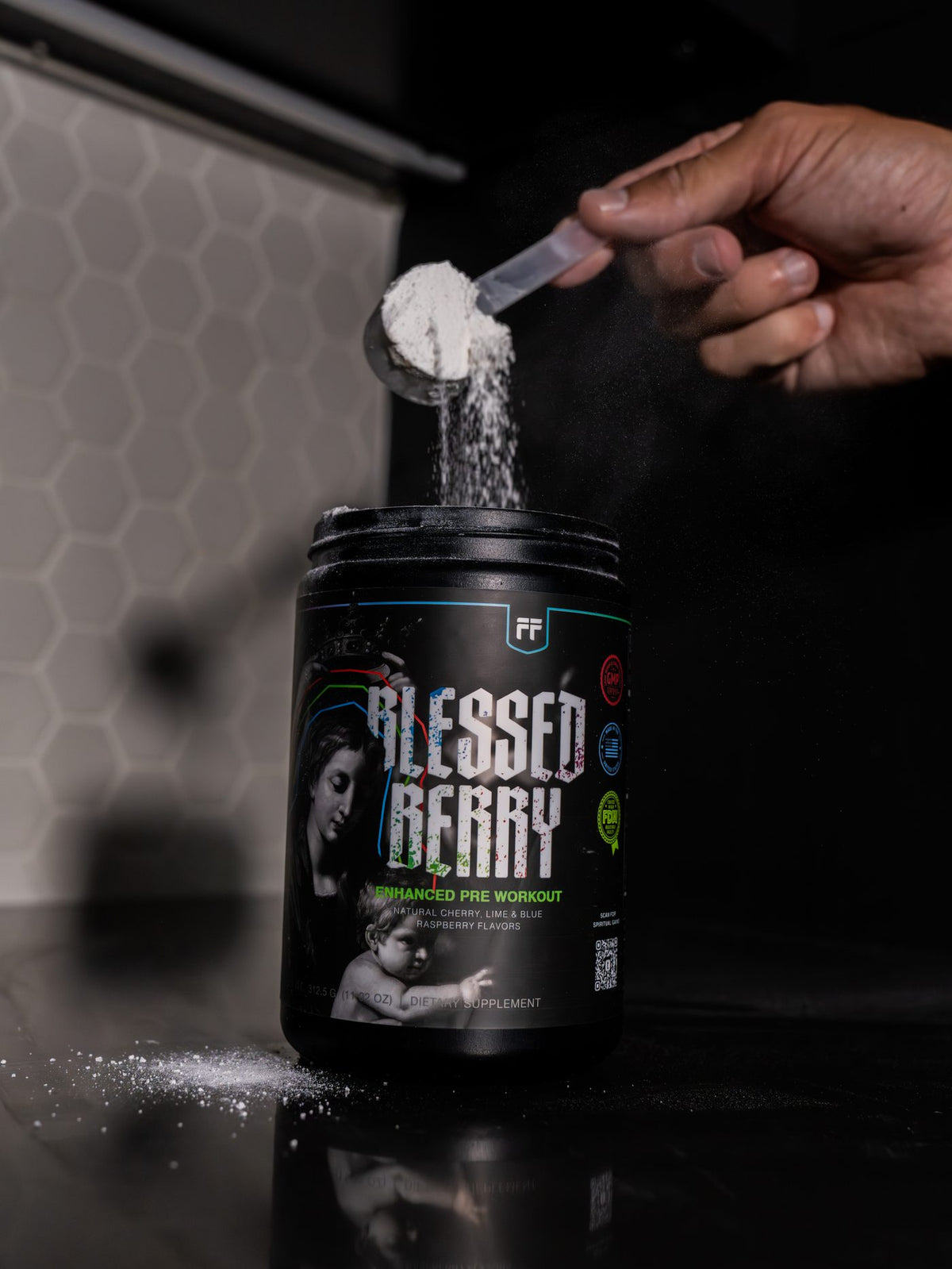 Blessed Berry pre-workout being scooped from the tub