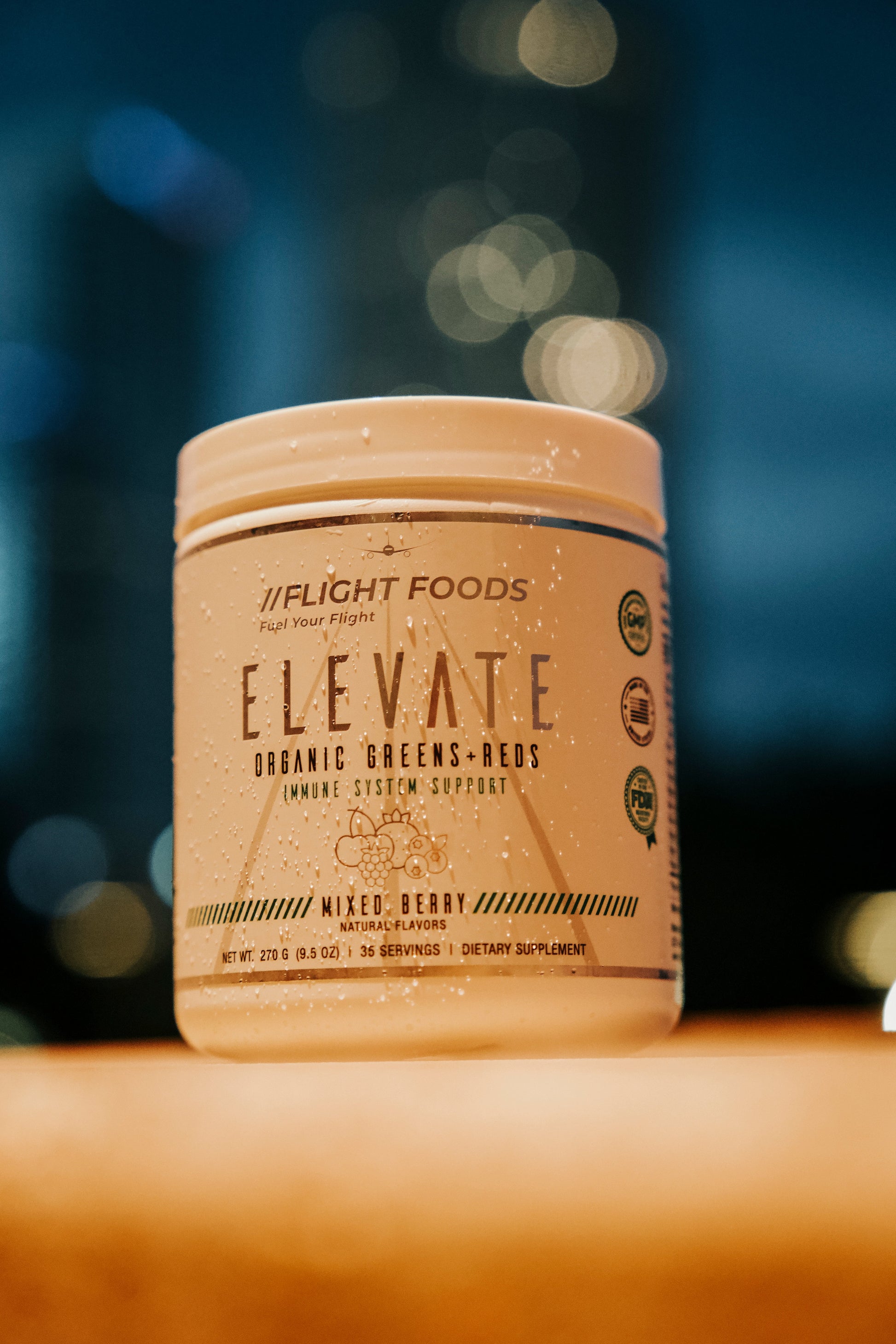 Jars of Elevate Organic Greens and Reds dietary supplement on New York background