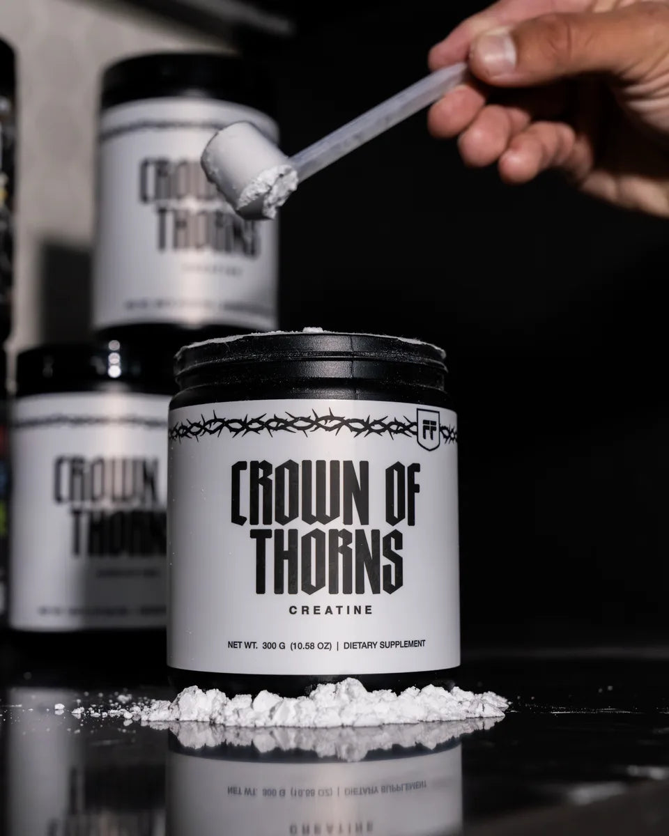 A scoop of Crown of Thorns Creatine Monohydrate over the tub